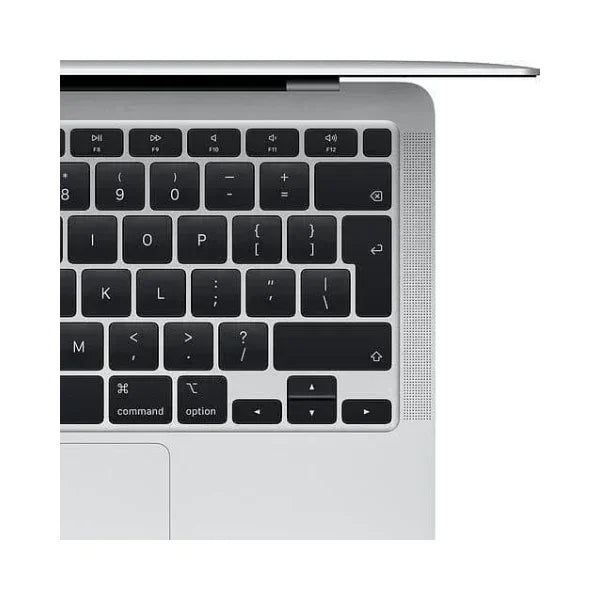 A close-up of the top-right corner of an Apple MacBook Air 2018 A1932 keyboard shows black keys with white letters, part of the trackpad, and a section of the slim silver body and speaker grille.