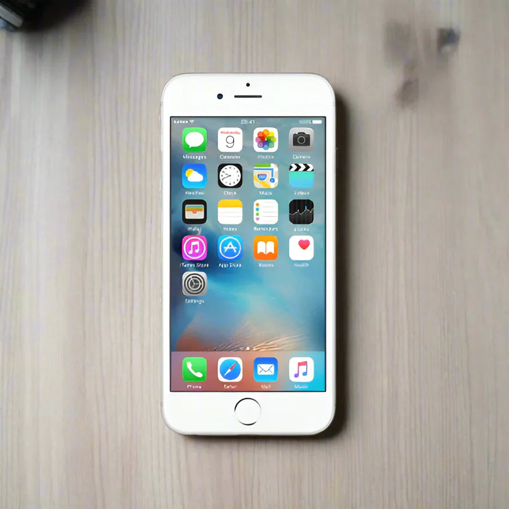 An Apple iPhone 6S Plus 128GB Silver Unlocked Mobile Phone | Wty sits on a light wooden surface with its home screen and app icons visible.