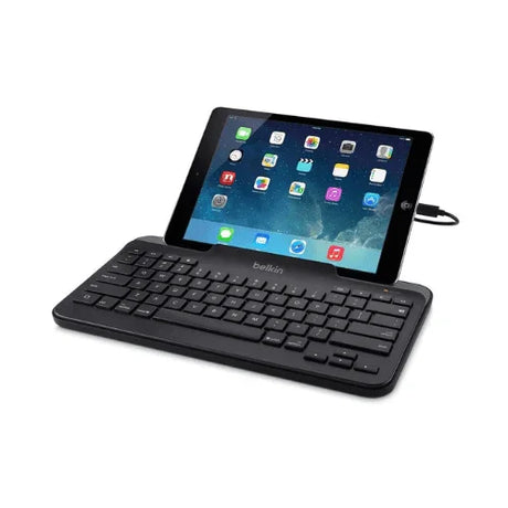 A tablet with app icons on its screen is paired with a refurbished Belkin B2B130 Tablet Keyboard with Stand for iPad | Wty, both resting on a white surface.