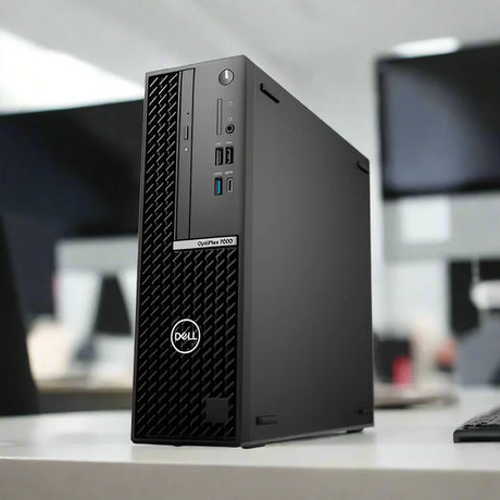 A certified refurbished Dell OptiPlex 7000 SFF i7-12700 2.1GHz 32GB 256GB desktop sits on a white office desk, with blurred monitors and equipment in the background.