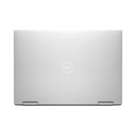 A closed silver Dell XPS 13 7390 2-in-1 (i7, 16GB, 512GB SSD, 13.4 Touch), viewed from above with a centered Dell logo on the lid. The laptop shows a sleek, minimalist design and visible bottom-edge hinges.
