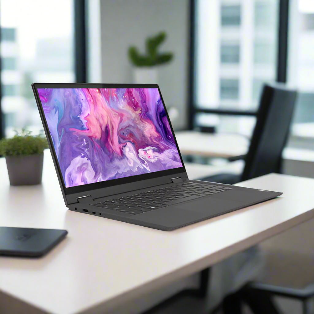 A Lenovo Flex 5 2-in-1 laptop (Pentium Gold 7505, 8GB RAM, 256GB SSD, 14" Touch, Windows 11 Home) sits open on a white desk in a modern office with a potted plant, phone, and empty chair in the background.
