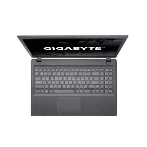 A GIGABYTE P15FV5 gaming laptop with Intel Core i7-6700HQ, 16GB RAM, 512GB + 2TB storage, and GTX 950M is partially open on a white background, showing its keyboard, touchpad, and the “GIGABYTE” screen logo.