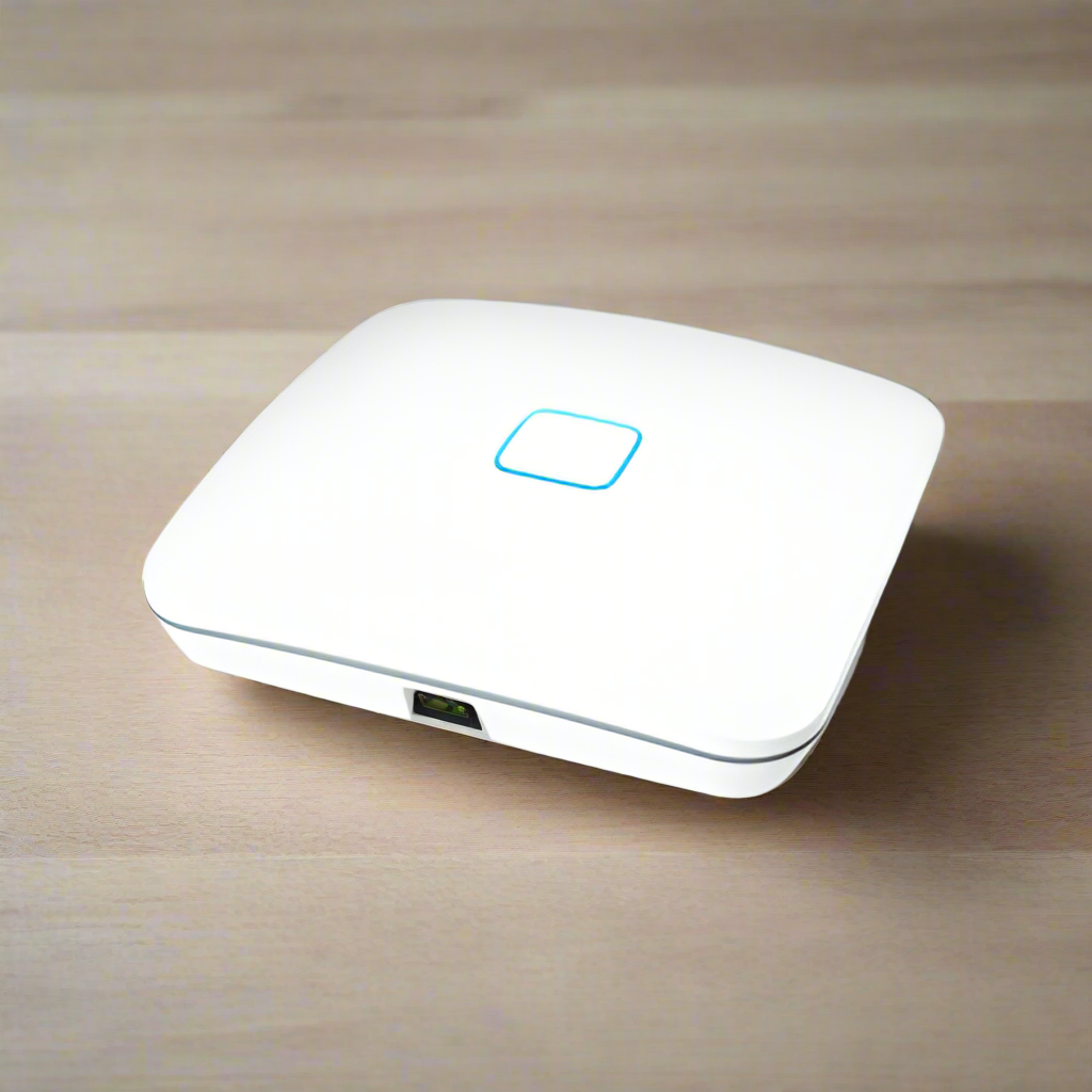 The Open Mesh A62 Tri-Band WiFi Access Point 802.11ac | Wty by Open Mesh, a white enterprise device with a glowing blue square indicator on top and one visible Ethernet port, sits on a light wooden surface.