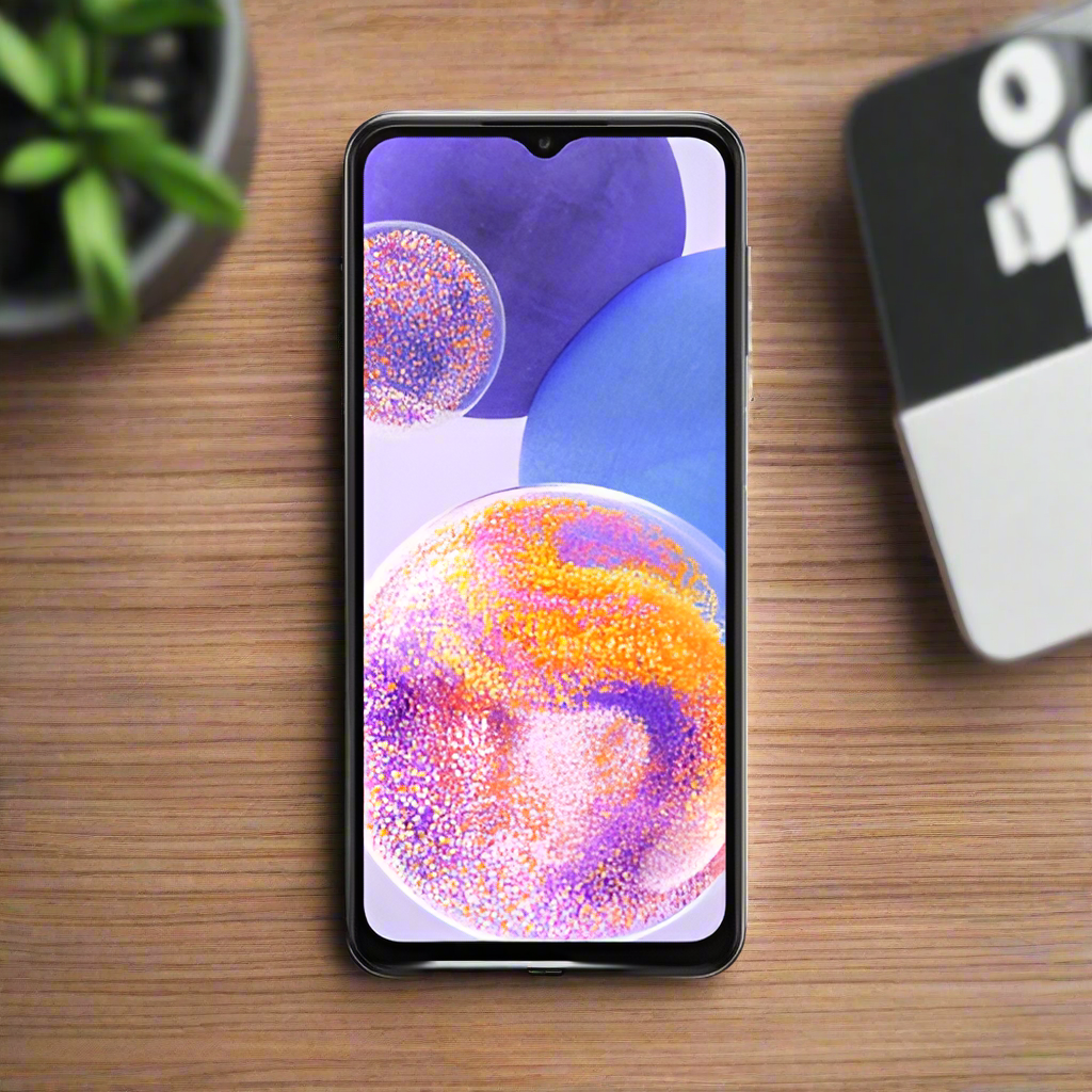A refurbished Samsung Galaxy A23 SM-A235F 128GB Black Unlocked Smartphone by Samsung, displaying a vibrant wallpaper with purple, blue, and orange bubbles, sits on a wooden surface with a plant partially visible nearby.