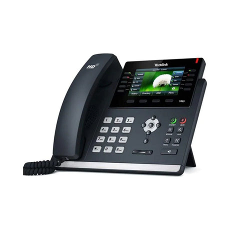The Yealink SIP-T46S Gigabit IP Phone + Adapter | Wty is a modern business IP phone with a corded handset, color screen with icons and menus, and multiple navigation buttons—ideal for efficient workplaces.