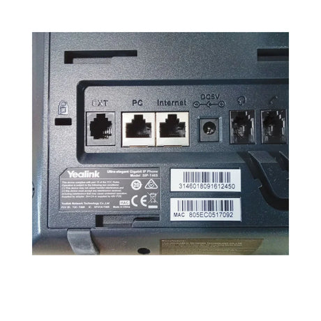 Close-up of the Yealink SIP-T46S Gigabit IP Phone + Adapter | Wty back panel, showing ports labeled EXT, PC, Internet, and DC5V, plus a barcode, serial number, and MAC address—perfect for Yealink business communication setups.