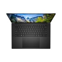 A black Dell Precision 5550 i7 mobile workstation with a full keyboard, large touchpad, and a 15.6" display showing cliffs, trees, and blue sky is viewed from above.