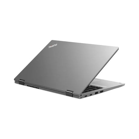 A silver Lenovo ThinkPad Yoga L390 i5 8265U 14" Touch laptop is shown partially open from the back left, displaying its keyboard, side ports, and ThinkPad logo on the lid against a plain white background.