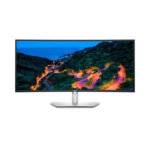 The Dell U3421WE 34" Curved IPS Monitor displays a vibrant winding mountain road at dusk with lush hills, an ocean view, and stunning clarity from its 3440x1440 resolution.