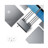 The ALOGIC Alogic MX2 DUPRMX2 USB-C Dual Display Dock 100W PD, with adapter included, connects Microsoft and Dell laptops to dual 4K UHD monitors. Certified Refurbished devices are arranged around the dock, displaying visible logos.