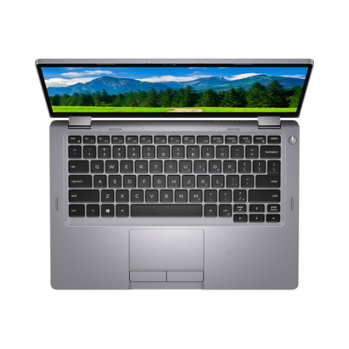 A silver Dell Latitude 5310 2-in-1 (i7, 16GB RAM, 256GB SSD, 13.3") is viewed from above with its screen open to a scenic mountain landscape, showing the keyboard and touchpad clearly visible.
