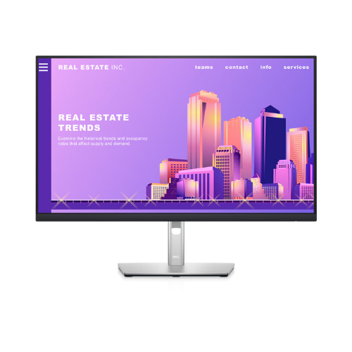 A Dell Professional P2722H IPS 27 monitor shows a website titled Real Estate Trends with a purple-pink city skyline illustration. Menu options—teams, contact, info, and services—are visible at the top.