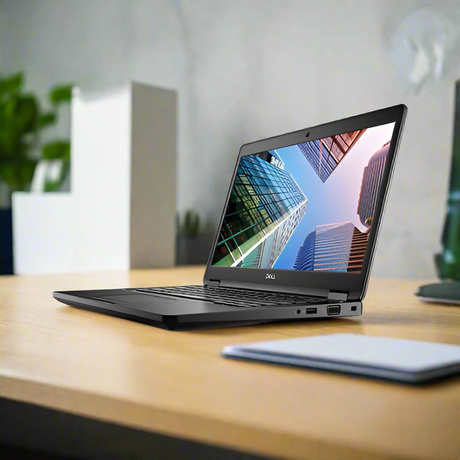 A black Certified Refurbished Dell Vostro 3578 i7 8550U laptop with 8GB RAM and 256GB SSD sits open on a wooden desk, showing skyscrapers on its 15.6 screen, with blurred office items, plants, and a closed notebook nearby.
