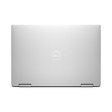 A closed Dell Refurbished XPS 9310 2-in-1 i7 laptop is shown from above, featuring a centered Dell logo on the lid and two hinges at the bottom.