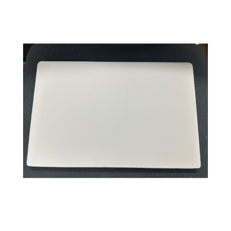 A closed Dell Latitude 5430 Laptop 14" Core i5 16GB 256GB Touch Win 11 Pro + Skin, showing a subtle logo on top, rests on a dark textured surface.