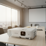 A certified refurbished Epson EB-W140 WXGA projector (3300 lumens, WIFI, 3LCD, HDMI, USB) in white with front lens and vented sides is shown on a white background. It delivers reliable performance and excellent image clarity.