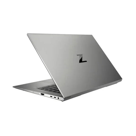 A silver HP ZBook Studio G8, featuring a 15.6" display, Intel i9 processor, 32GB RAM, 1TB SSD, and RTX A2000 graphics is partially open showing its sleek design and multiple ports. Certified refurbished and running Windows 11 Pro.