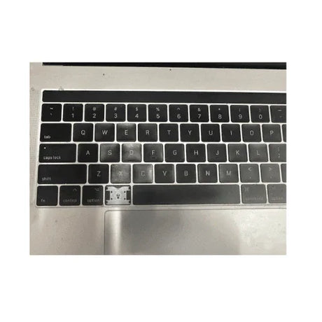 An Apple MacBook Pro Mid 2017 A1707 (15.4", i7 7700HQ, 16GB RAM, 512GB SSD) with a missing keyboard key that reveals the switch underneath; surrounding keys and trackpad are visible. Brand: Apple.