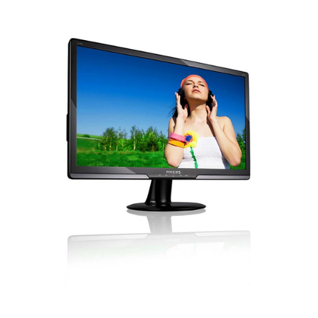 The Philips 244EL2SB 24" Full HD LED monitor, featuring a black stand and reflective surface, displays an image of a woman in a white dress enjoying music outdoors on green grass beneath a blue sky.