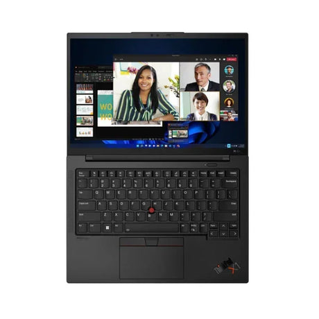 A black Lenovo ThinkPad X1 Carbon G10 i7 1255U, seen from above, shows a virtual meeting with four people on its 14" screen; the keyboard and touchpad are visible.