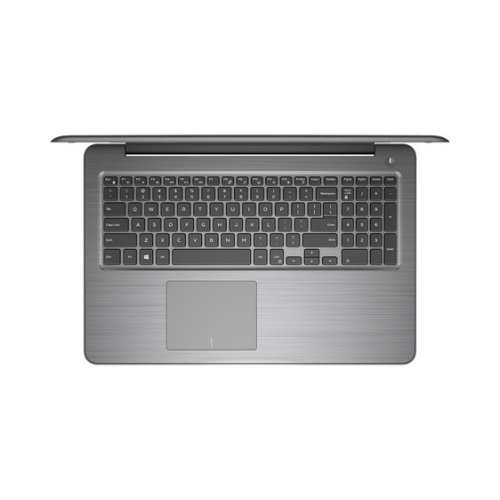 A silver Dell Inspiron 15 5567 laptop with Intel i5-7200U, 8GB RAM, and 1TB storage is viewed from above. The full keyboard with numeric keypad and large touchpad are visible; the 15.6" screen is open at the top edge.
