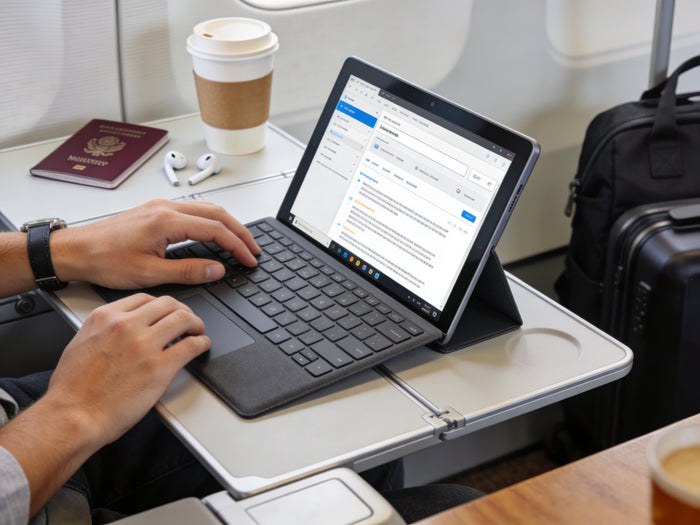 Artist using Microsoft Surface tablet with stylus pen for digital illustration